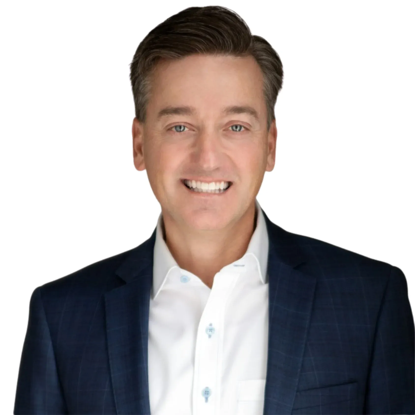 A smiling man wearing a blue blazer over a white shirt.