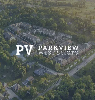 Aerial view of a community featuring residential buildings and greenery, with the text "PV Parkview West Scioto" overlaying the image.